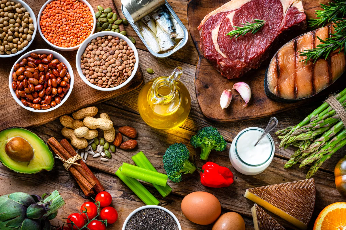 Healthy organic food arranged on a rustic wooden table background for a well-balanced diet. High resolution 42Mp studio digital capture with Sony A7rII and Sony FE 90mm f2.8 macro G OSS lens